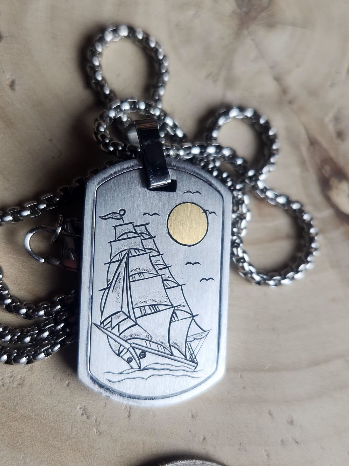 Ship pendant hand engraved with 24k Gold Sun