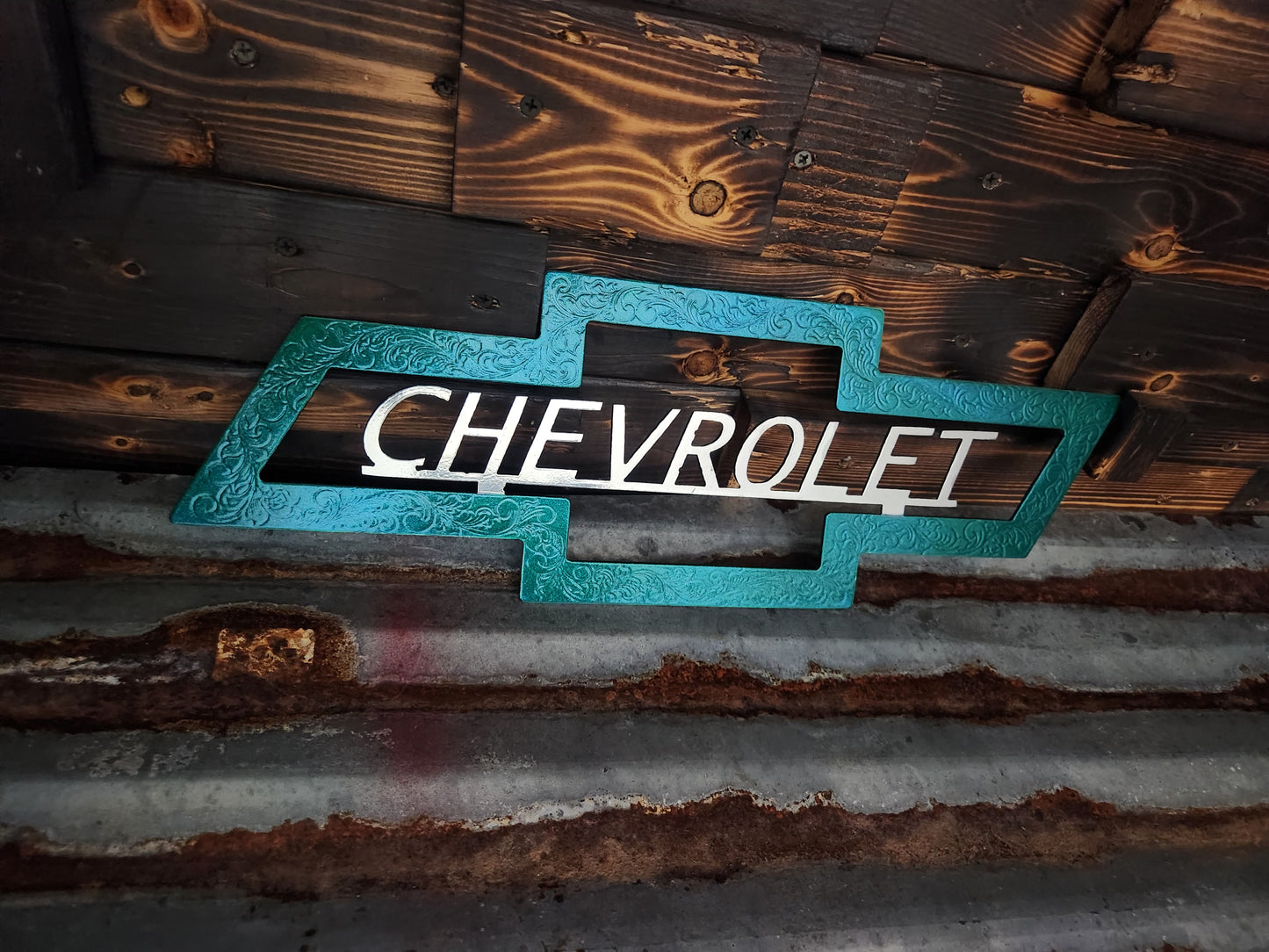 Green and silver Chevrolet sign