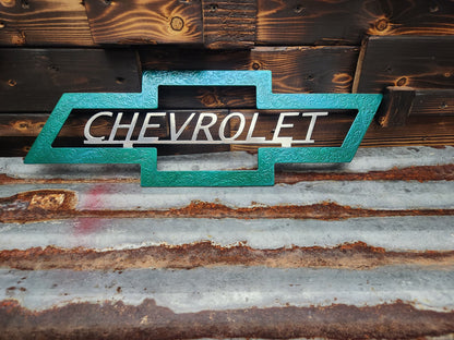 Green and silver Chevrolet sign