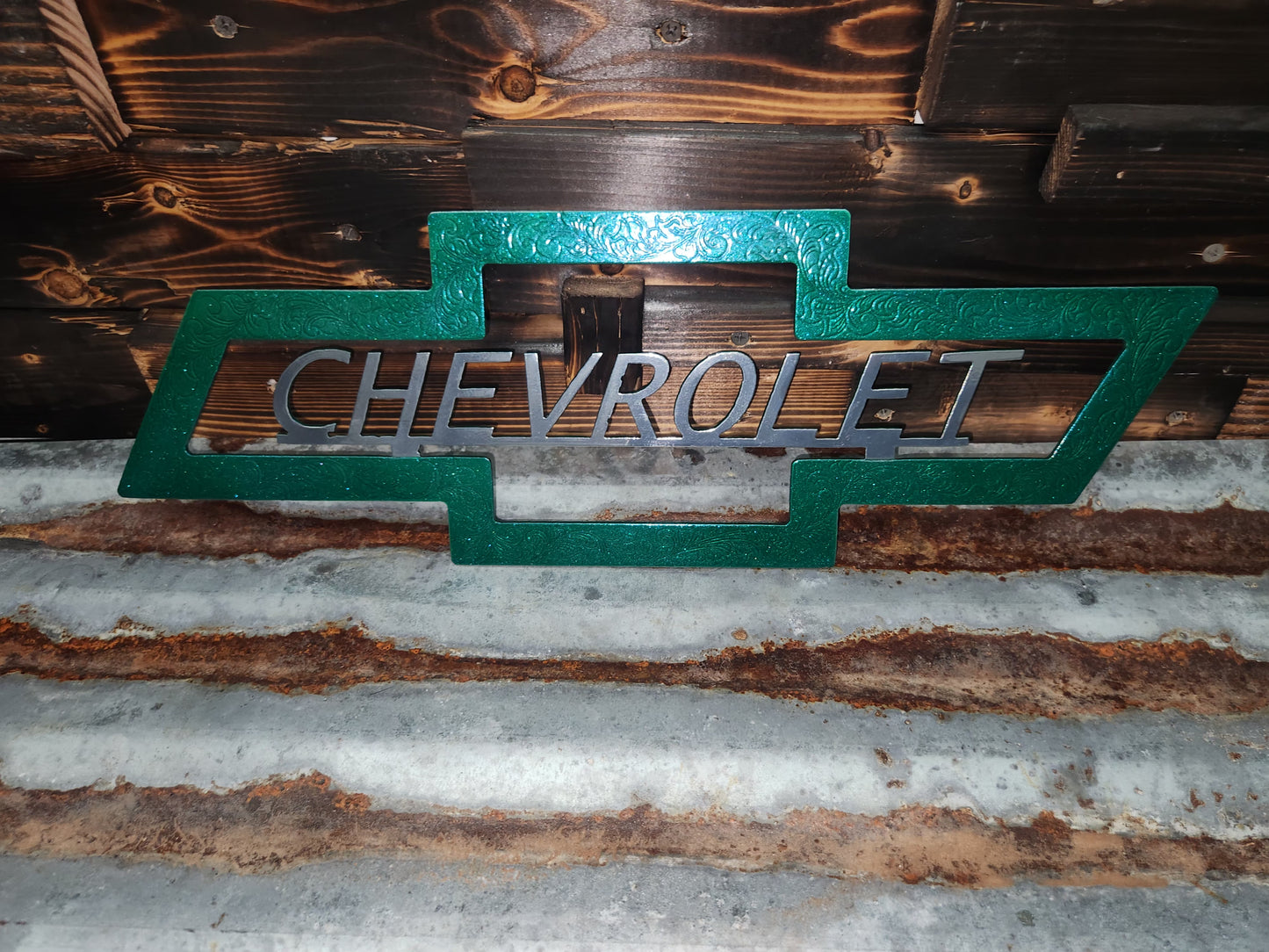 Green and silver Chevrolet sign