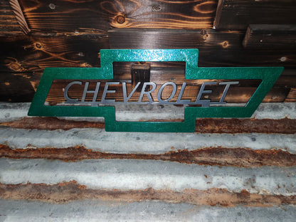 Green and silver Chevrolet sign