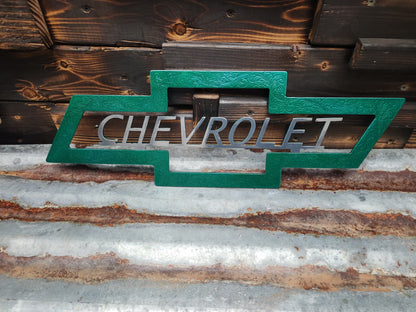 Green and silver Chevrolet sign